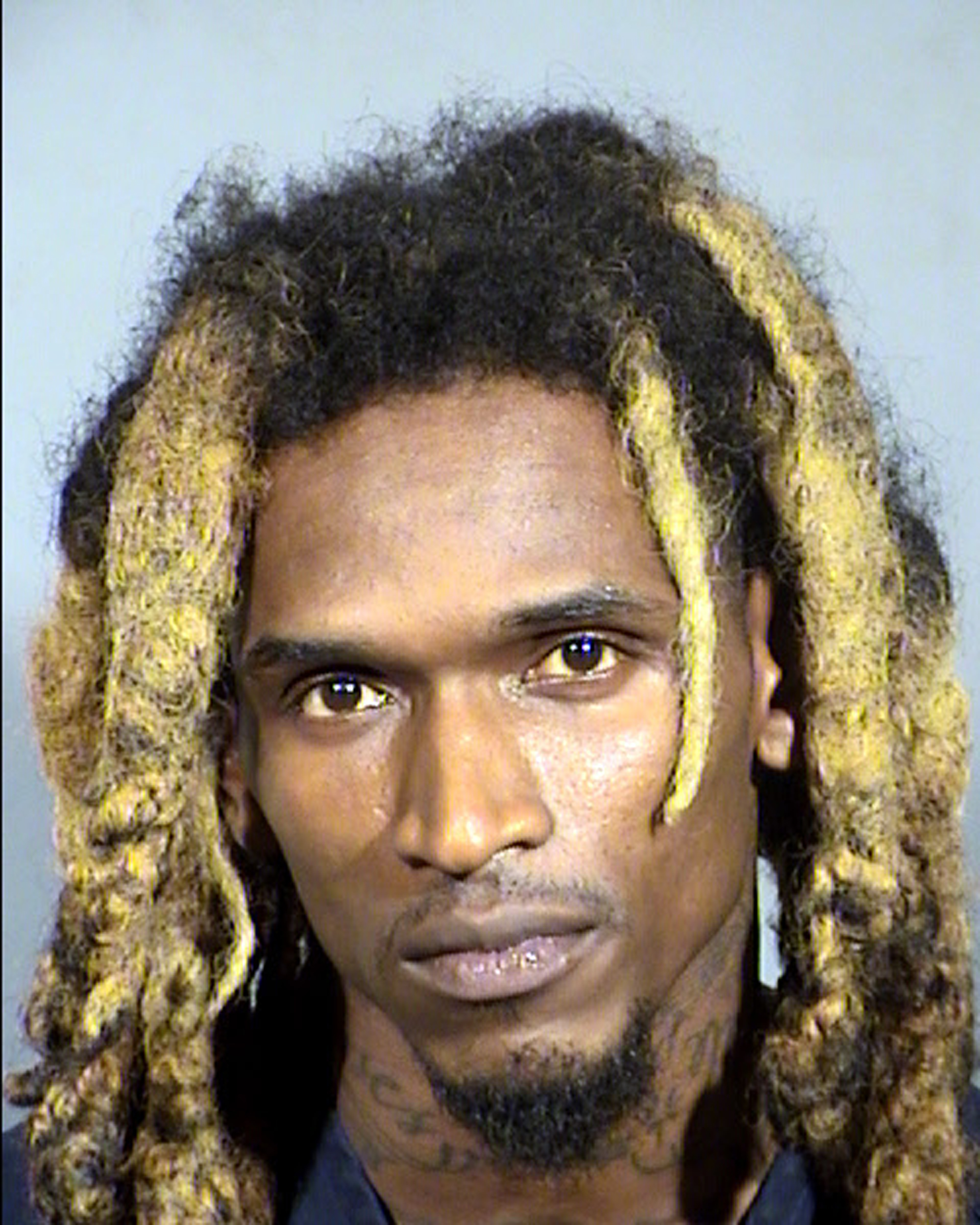 This undated Clark County Detention Center booking photo shows Moises Johnson, of West Palm Beach, Fla. Police say Johnson was arrested Tuesday, Feb. 21, 2017, pending a court appearance on felony assault and weapon charges after a gunshot was fired in the air during a fight between the three-member hip hop music group Migos and rapper Sean Kingston outside a Las Vegas Strip conference venue. No injuries were reported. (Clark County Detention Center/Las Vegas Metropolitan Police Department via AP)