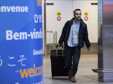Iranian-born bioengineer researcher Nima Enayati walks out of an entrance after arrival at John F. Kennedy International Airport in New York, Sunday, Feb. 5, 2017. Just hours after an appeals court blocked an attempt to re-impose the travel ban, Iranian researcher Nima Enayati checked in on an Emirates Airline flight direct from Milan’s Malpensa airport to New York’s JFK on Sunday afternoon. (AP Photo/Alexander F. Yuan)
