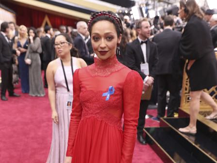 Ruth Negga, wearing the ACLU ribbon, arrives at the Oscars on Sunday, Feb. 26, 2017, at the Dolby Theatre in Los Angeles. (Photo by Matt Sayles/Invision/AP)