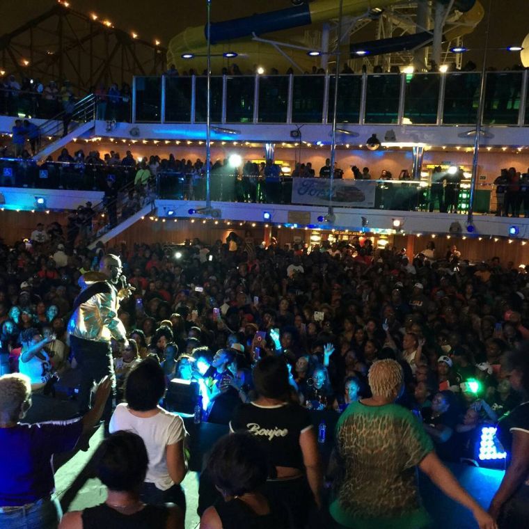 The crowd watches R. Kelly onstage.