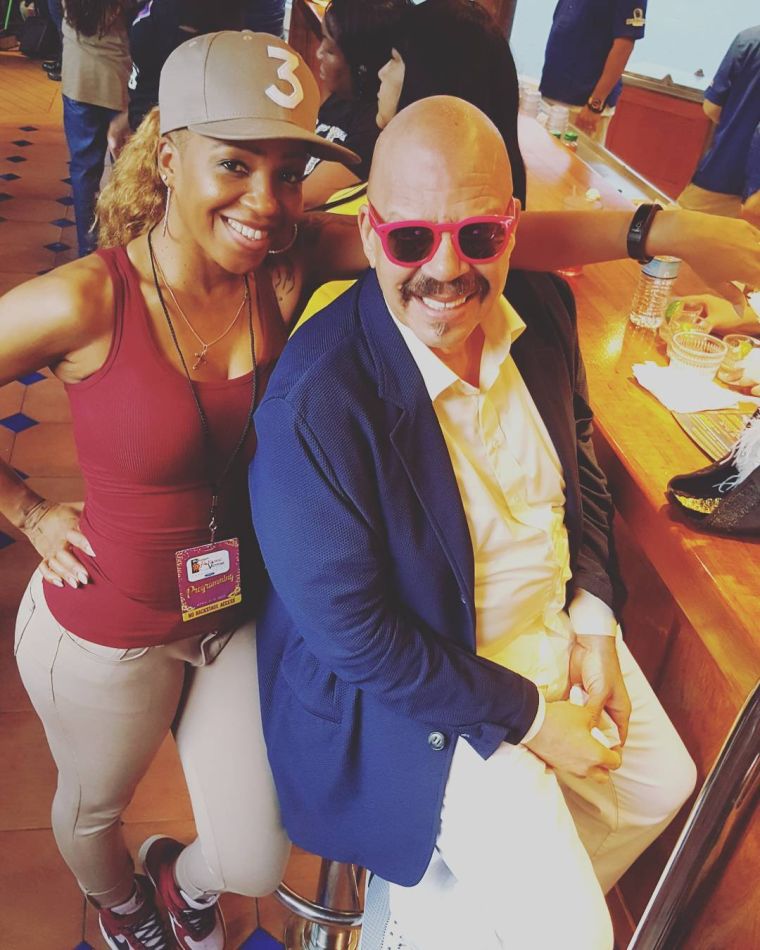 Tom Joyner with his goddaughter.