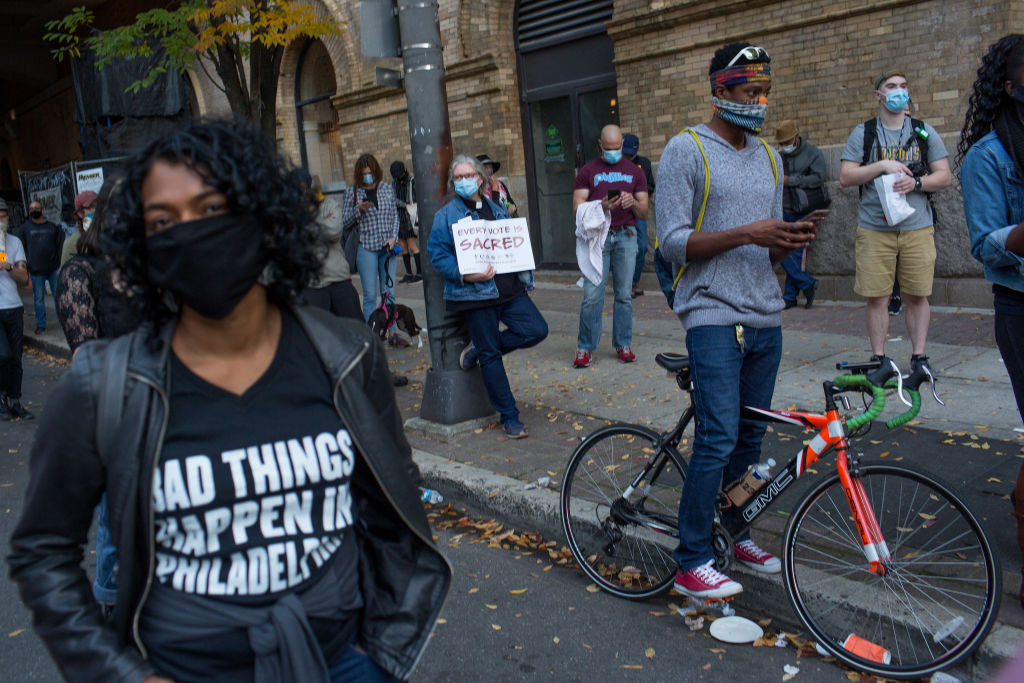 Trump supporters and anti-Trump voters gather outside Philadelphia ballot collection center