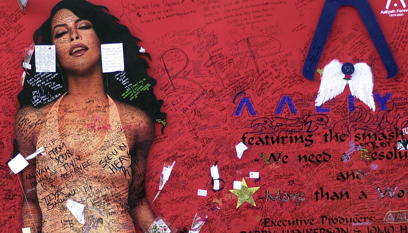 Aaliyah Fans Sign Mural In Tribute.