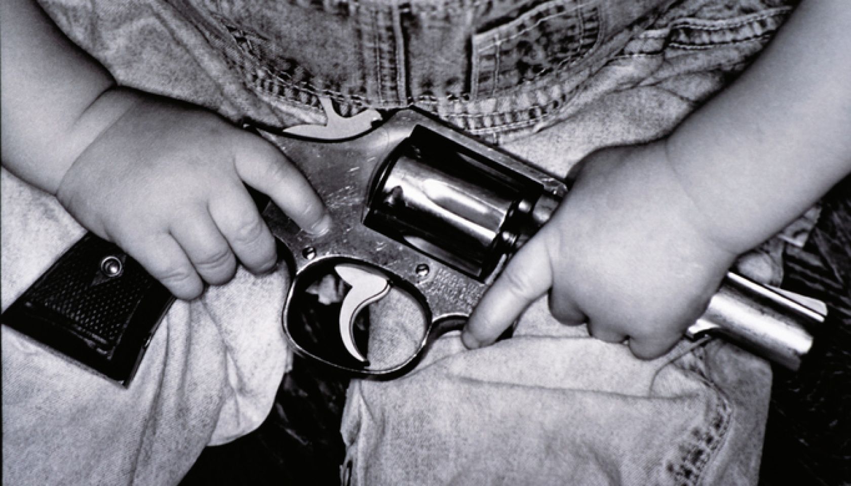 Child Holding Gun