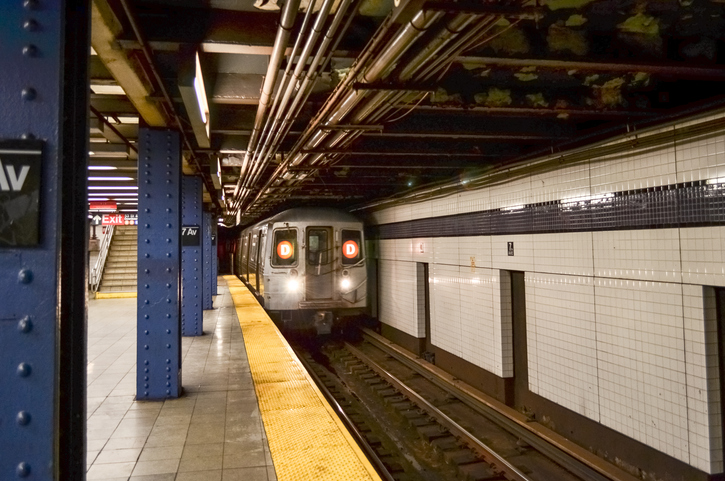 Metro train entering City Hall subway station in New York City, USA