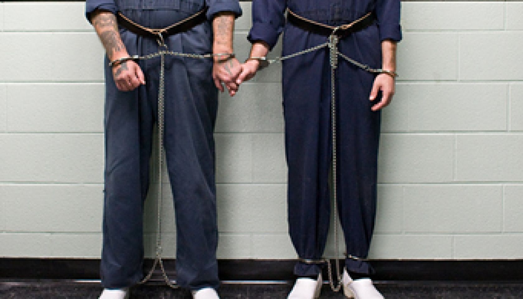 Prisoners holding hands