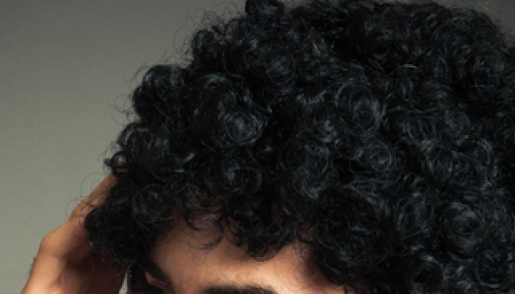 Blackhead Boy touching his hair in front of the mirror