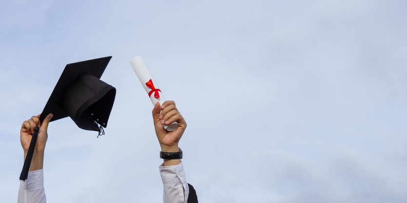 Graduation Day.man Holding Certificate Paper And Mortar Board .
