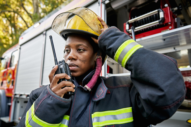 Black Female Firefighter Using Walkie-Talkie
