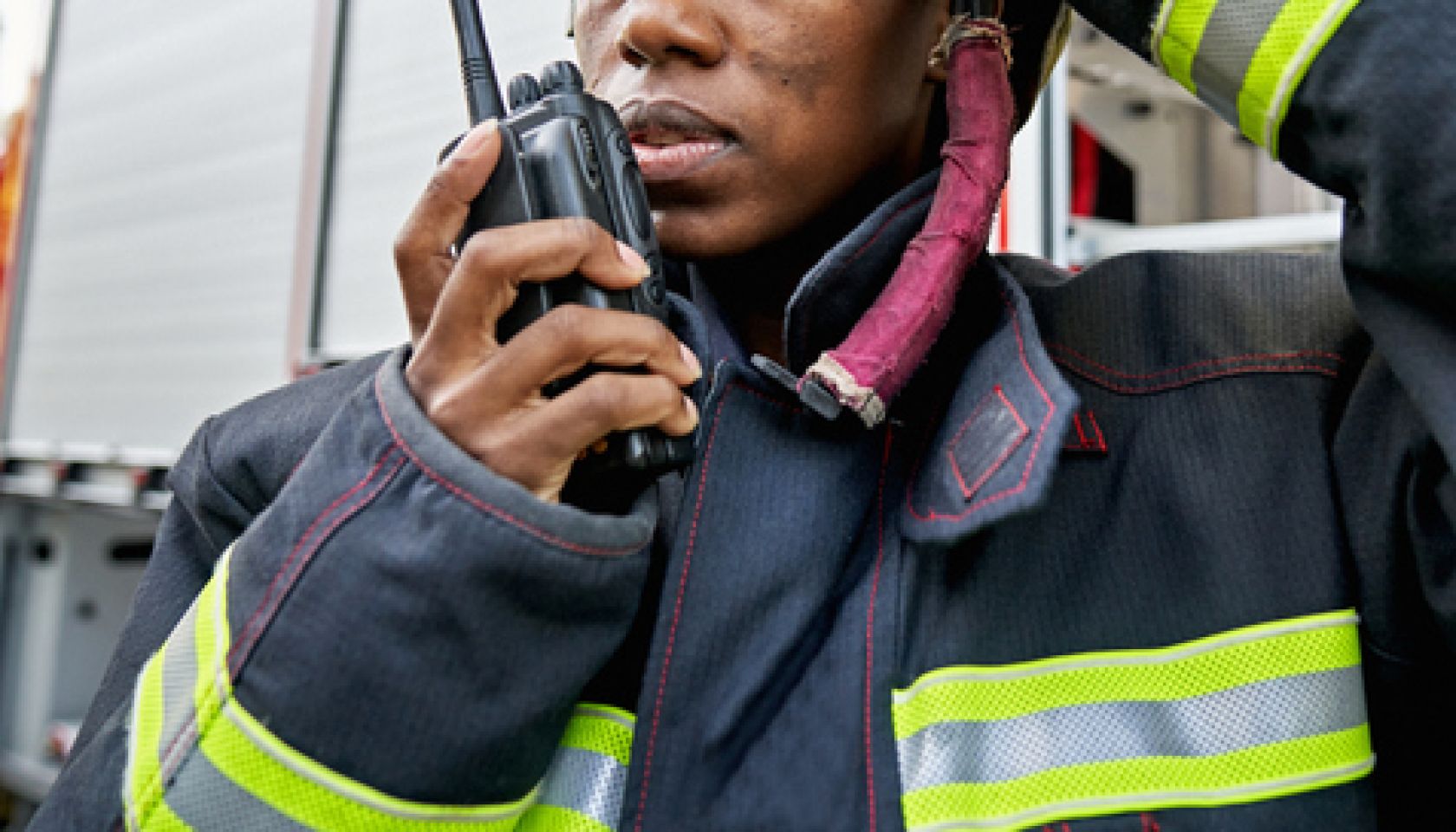 Black Female Firefighter Using Walkie-Talkie