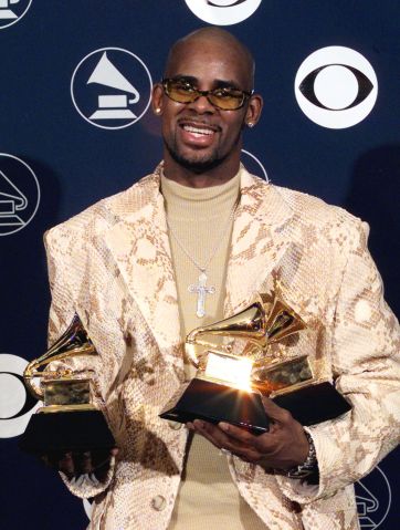 R. Kelly holds his three Grammy Awards 25 February