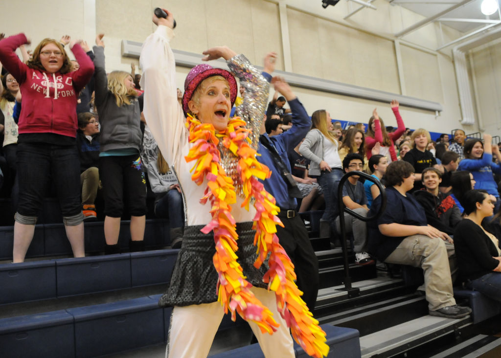 Photo by Tim Leedy 3/12/12PSSA Pep Rally at Conrad Weiser Middle School.Ruthie Wolfe, Emcee and 5th grade teacher does the wave.