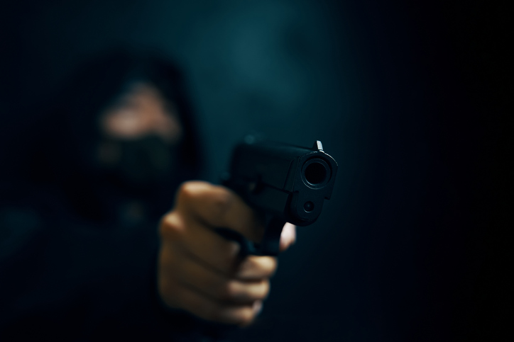 Portrait Of Young Man Holding Camera