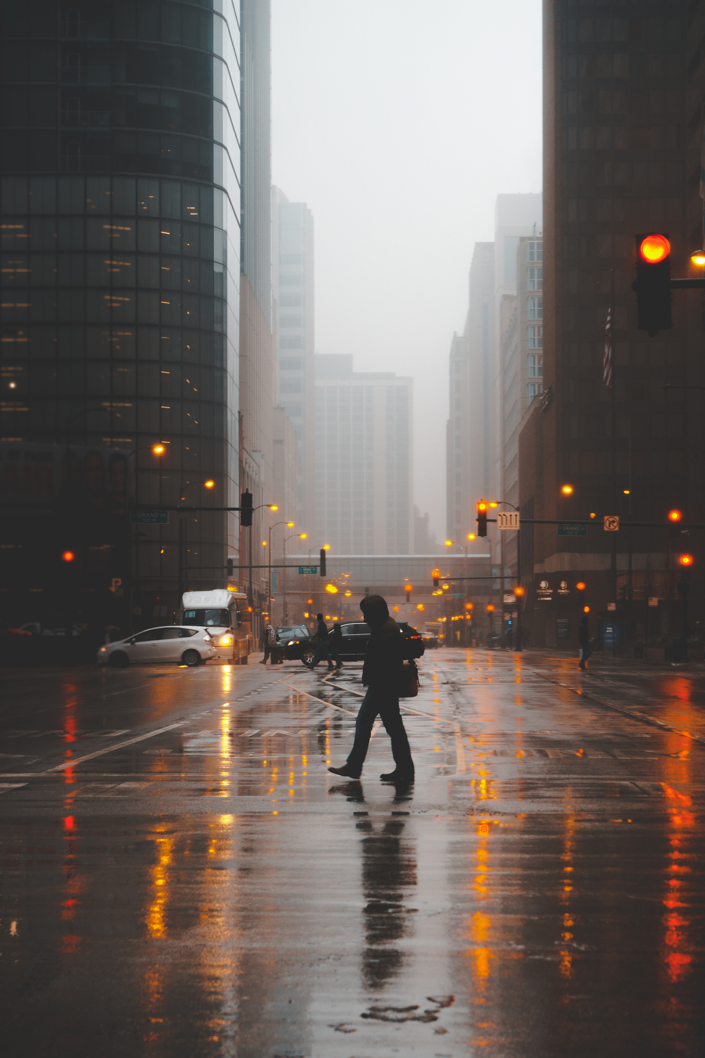 Silhouette of a Man crossing the street on a foggy evening, Chicago, Illinois, United States