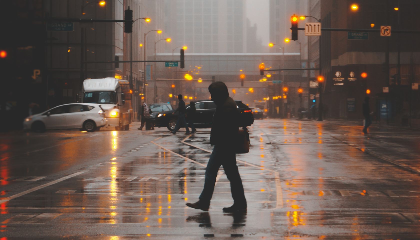Silhouette of a Man crossing the street on a foggy evening, Chicago, Illinois, United States