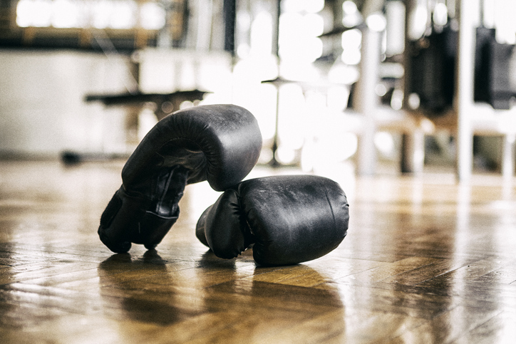 Boxing glove on the floor in gym