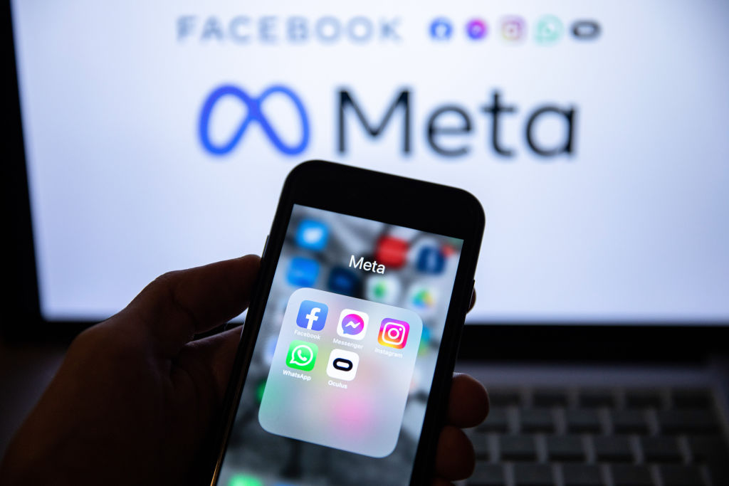 In this photo illustration, the app icons of Facebook,...