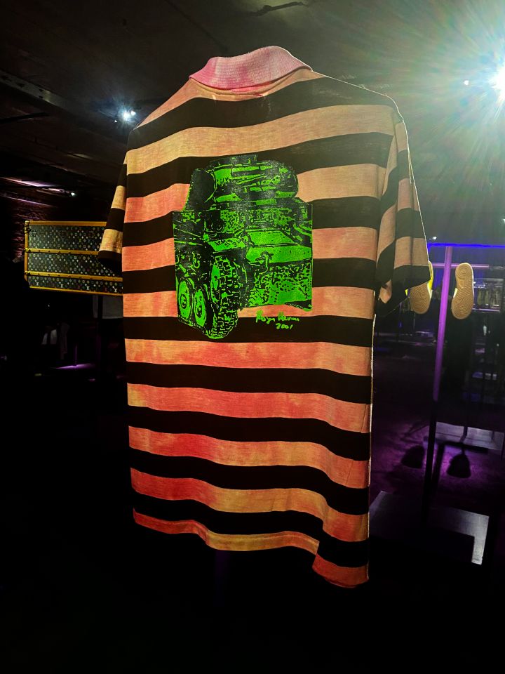 Pharrell Williams' Striped Polo Shirt From the "Lapdance" Music Video