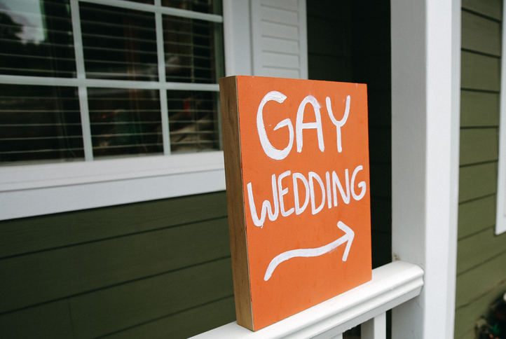 Sign with an arrow for a Gay LGBTQ Wedding service
