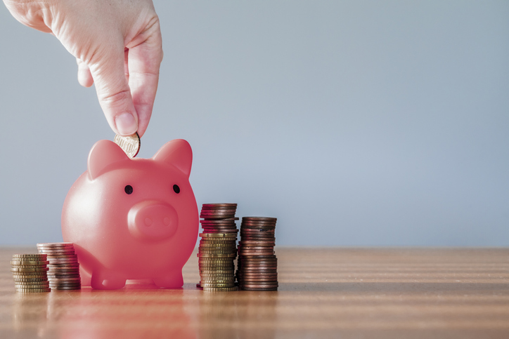 Piggy bank pink colour with money stack step up growing growth saving money, Concept financial business investment. Copy space for your text gray background