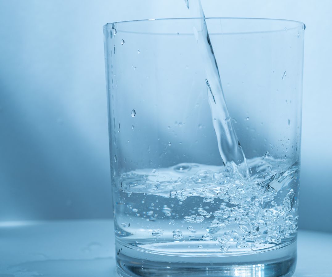 pour water into a glass