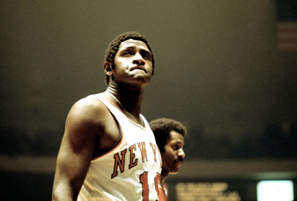 Willis Reed, Center, of the New York Knicks grimaces while waiting for the Boston Celtics to shoot free-throws during an NBA basketball game at Madison Square Garden on November 8, 1973.
