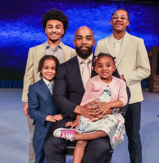Willie Moore Jr. takes a portrait with family at The White House