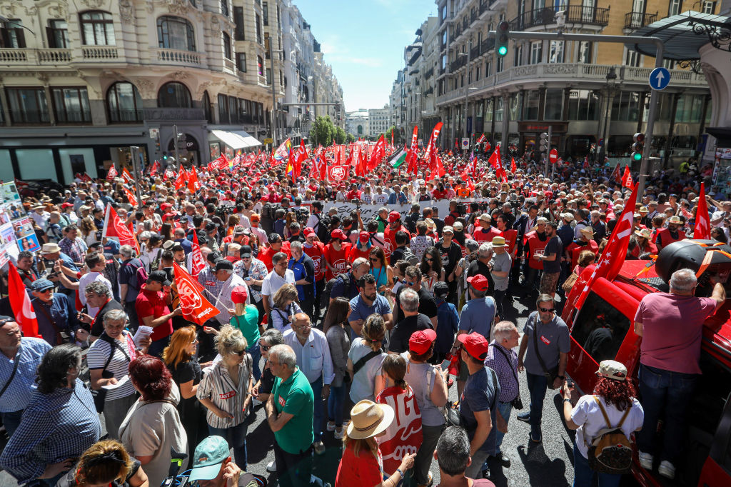 Thousands of protesters march along Gran Via Street during...