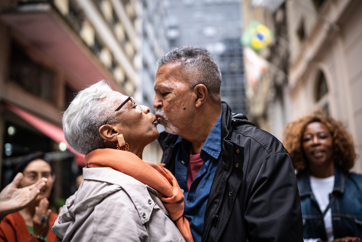 Senior couple kissing outdoors