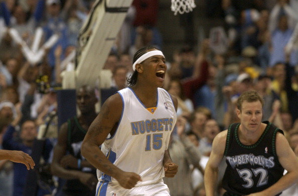 DENVER, CO, APRIL 24, 2004 - Denver Nuggets vs. Minnesota Timberwolves, playoffs.#15 Carmelo Anthony celebrates after working to make a basket with several assists from teammates. (DENVER POST STAFF PHOTO BY KATHRYN SCOTT OSLER)