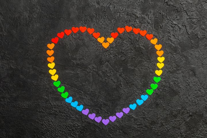 Rainbow heart on a black background. Hearts in the colors of the LGBT flag