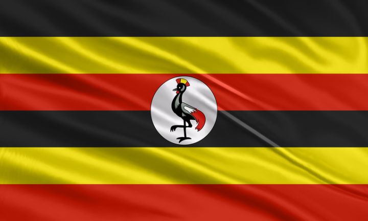 Uganda flag design. Waving Uganda flag made of satin or silk fabric. Vector Illustration.