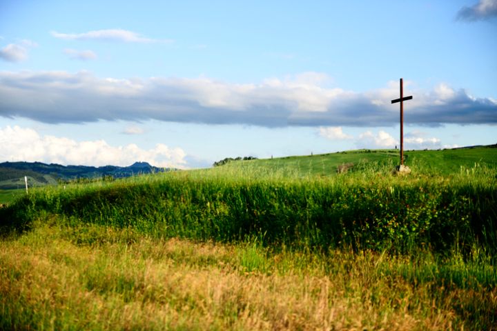 wide angle the Holy cross on the top of Chruch and cloudy background