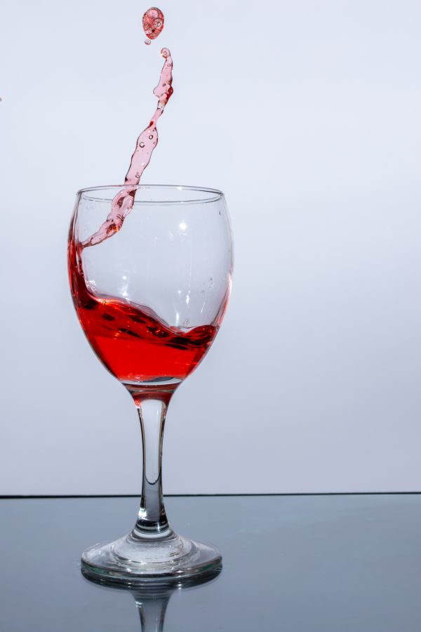 A beautiful splash of red wine in a glass