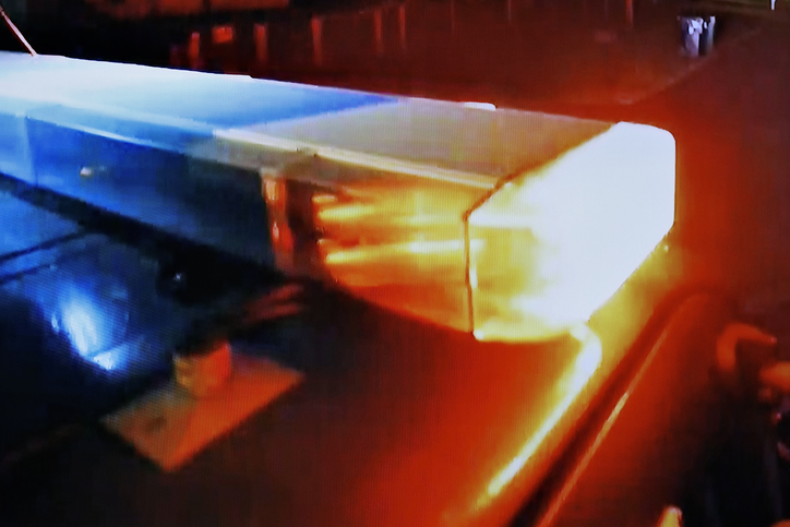 Police car with bright LED lights at a crime scene