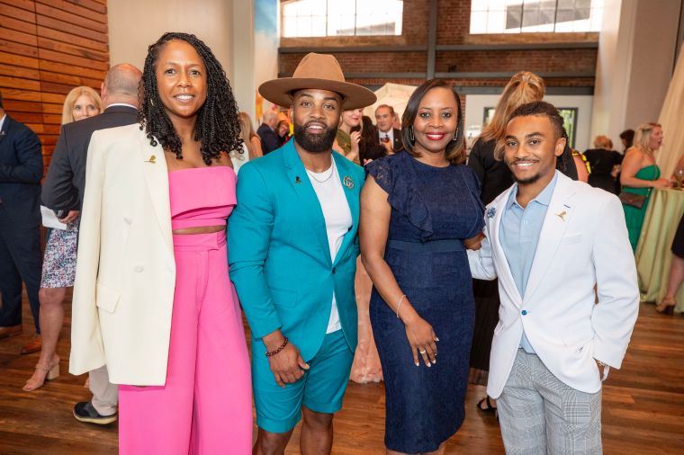 Willie Moore Jr. and family pose for pictures during the St Jude Children's Research Hospital 2023 Volunteer Awards Dinner
