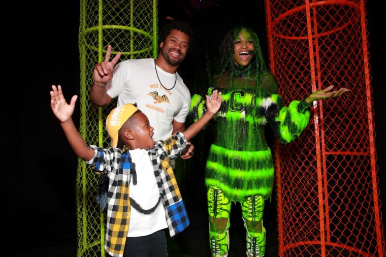 Future Zahir Wilburn, Russell Wilson and Ciara smile after Ciara was slimed at Nickelodeon Kids' Choice Sports 2019