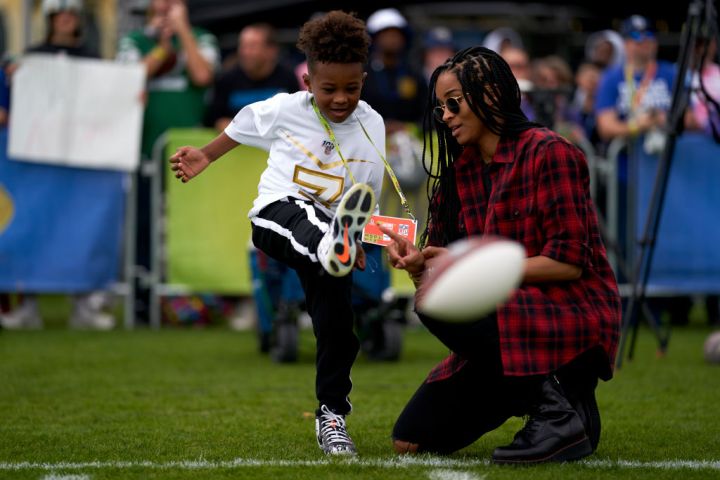 Pop singer Ciara plays football with her son after the NFC team practice in preparation for the 2020 Pro Bowl