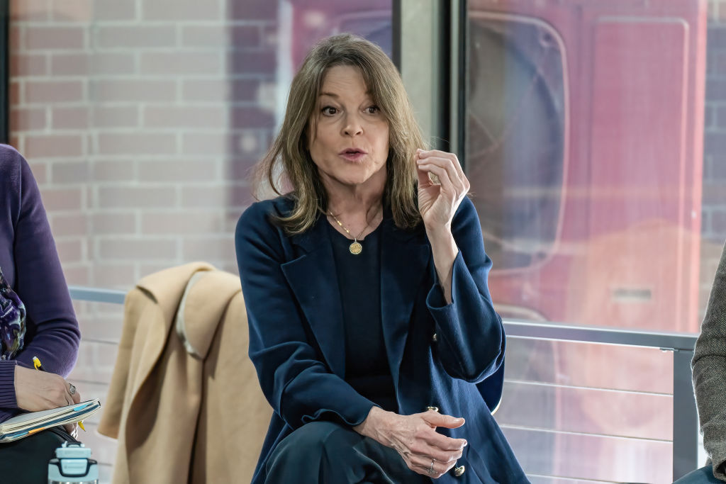 Marianne Williamson speaks to members of the public and...