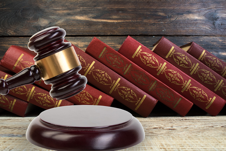 Law and Justice, Legality concept, Judge Gavel on a wooden background, Law library concept.
