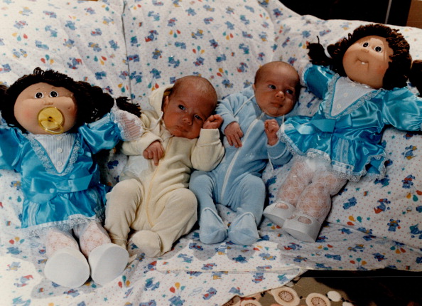 Seeing double: Two-month-old twins Julien and Malcolm Dalgliesh of Toronto are almost dwarfed by thi...