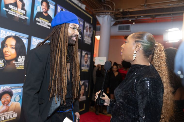 Ty Hunter interviewed by Jeroslyn JoVonn on the red carpet at Black Enterprise's '40 Under 40: Class Of 2023' gala