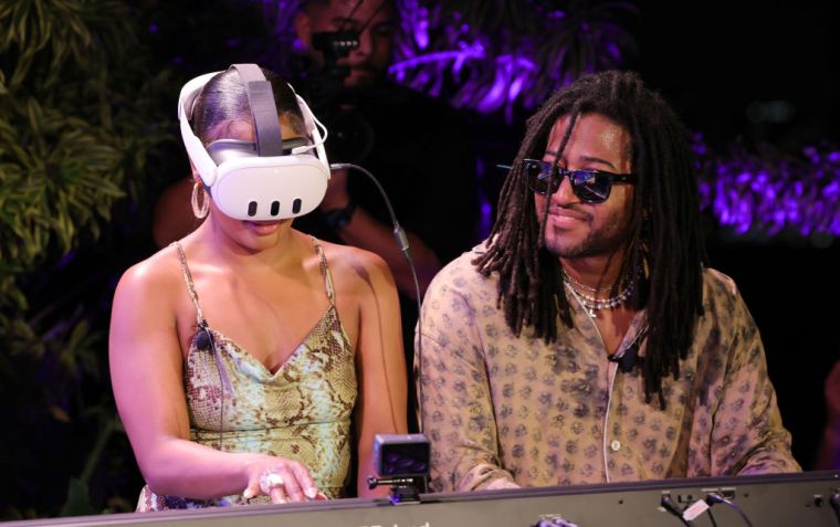 Victoria Monét and Austin Millz test out a Meta Quest 3 at the Meta Sonic Listening Party