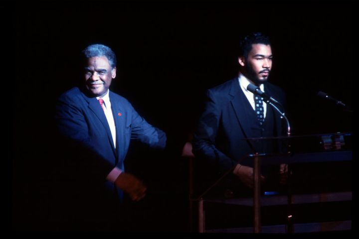 Former Chicago Mayor Harold Washington (1922 - 1987) and Dexter King at a birthday tribute to Martin Luther King Jr at the Medinah Temple (1985)