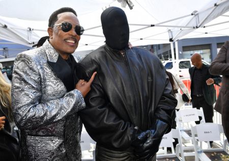 Charlie Wilson embraces Kanye West at his Hollywood Walk of Fame star ceremony