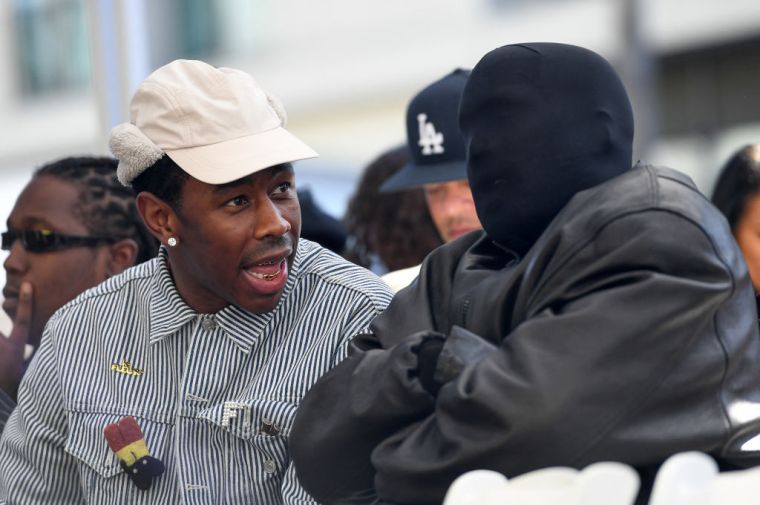 (L to R) Tyler, the Creator and Kanye West talk during Charlie Wilson's Hollywood Walk of Fame ceremony