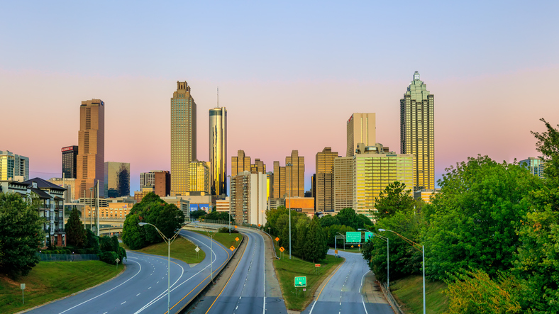 A view of the Atlanta skyline from Jackson Street Bridge at the golden hour in the morning - Atlanta, Georgia, USA.