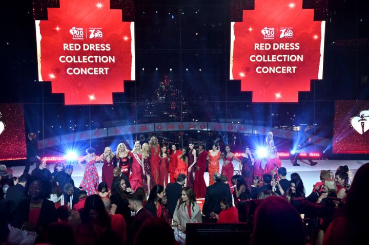 The women on the runway at the 2024 "Go Red for Women" Red Dress Collection Concert