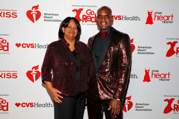 Regina Benjamin and Clay Lawrence on the red carpet at the 2024 "Go Red for Women" Red Dress Collection Concert