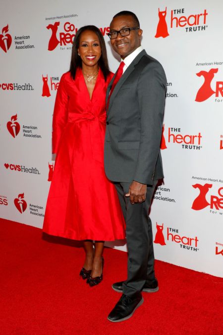 Cheryl Anderson and Eldrin Lewis on the red carpet at the 2024 "Go Red for Women" Red Dress Collection Concert